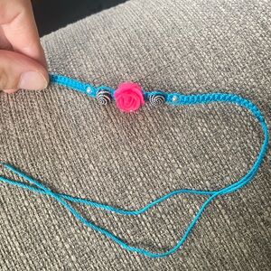 Bright blue tie on bracelet